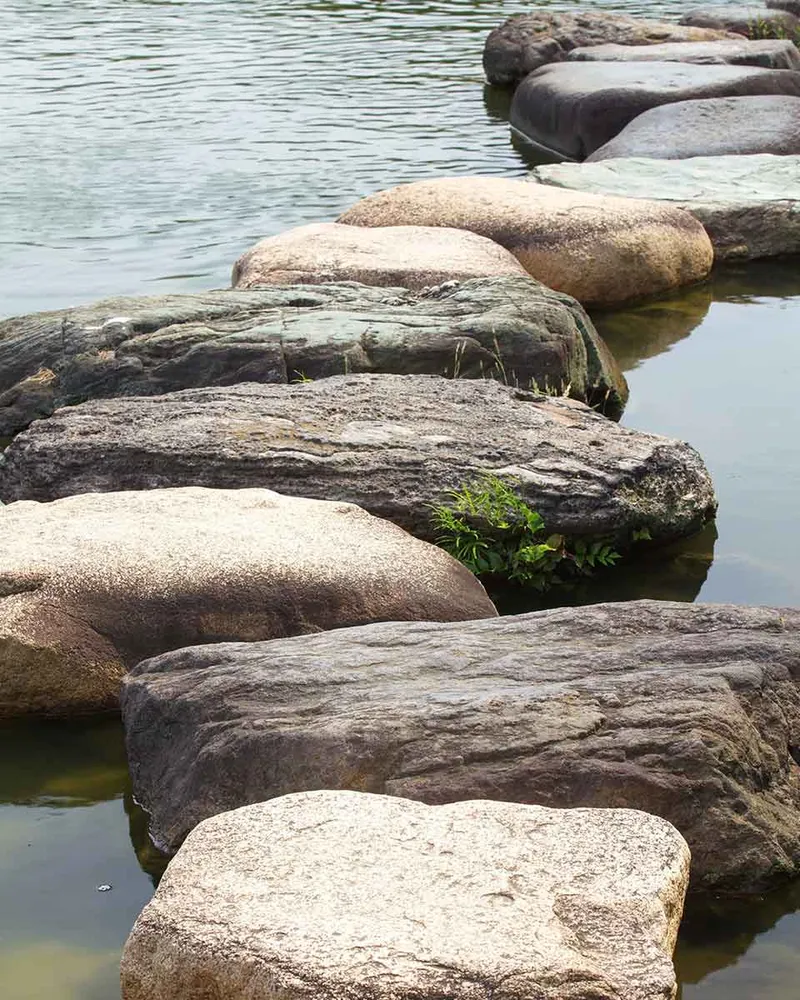 Stepping stones leading across the water