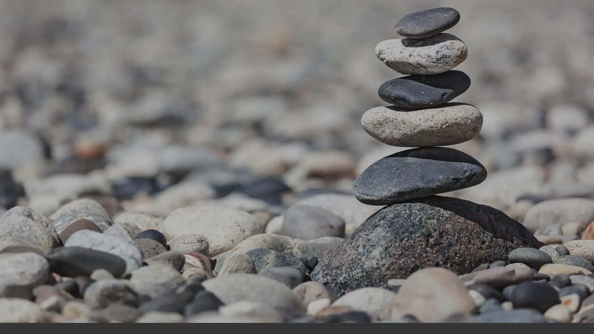 Stacked stones on a pebble beach